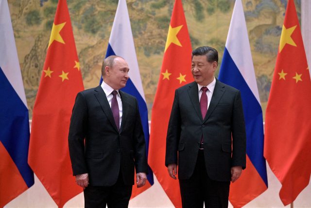 Vladimir Putin na setkání se Si Ťin-pchingem v Pekingu | foto: Sputnik Photo Agency,  Reuters